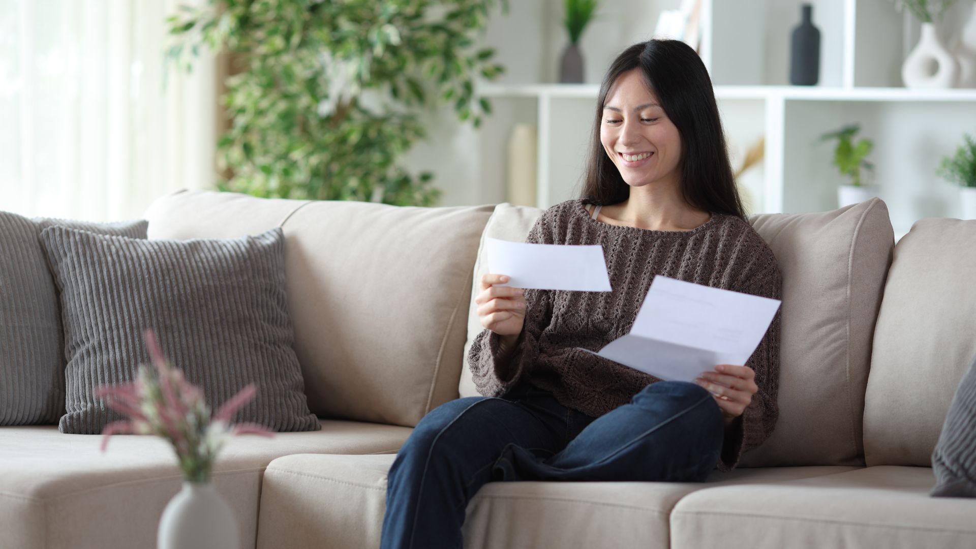 King & Beaty - happy woman looking at her personal injury settlement check